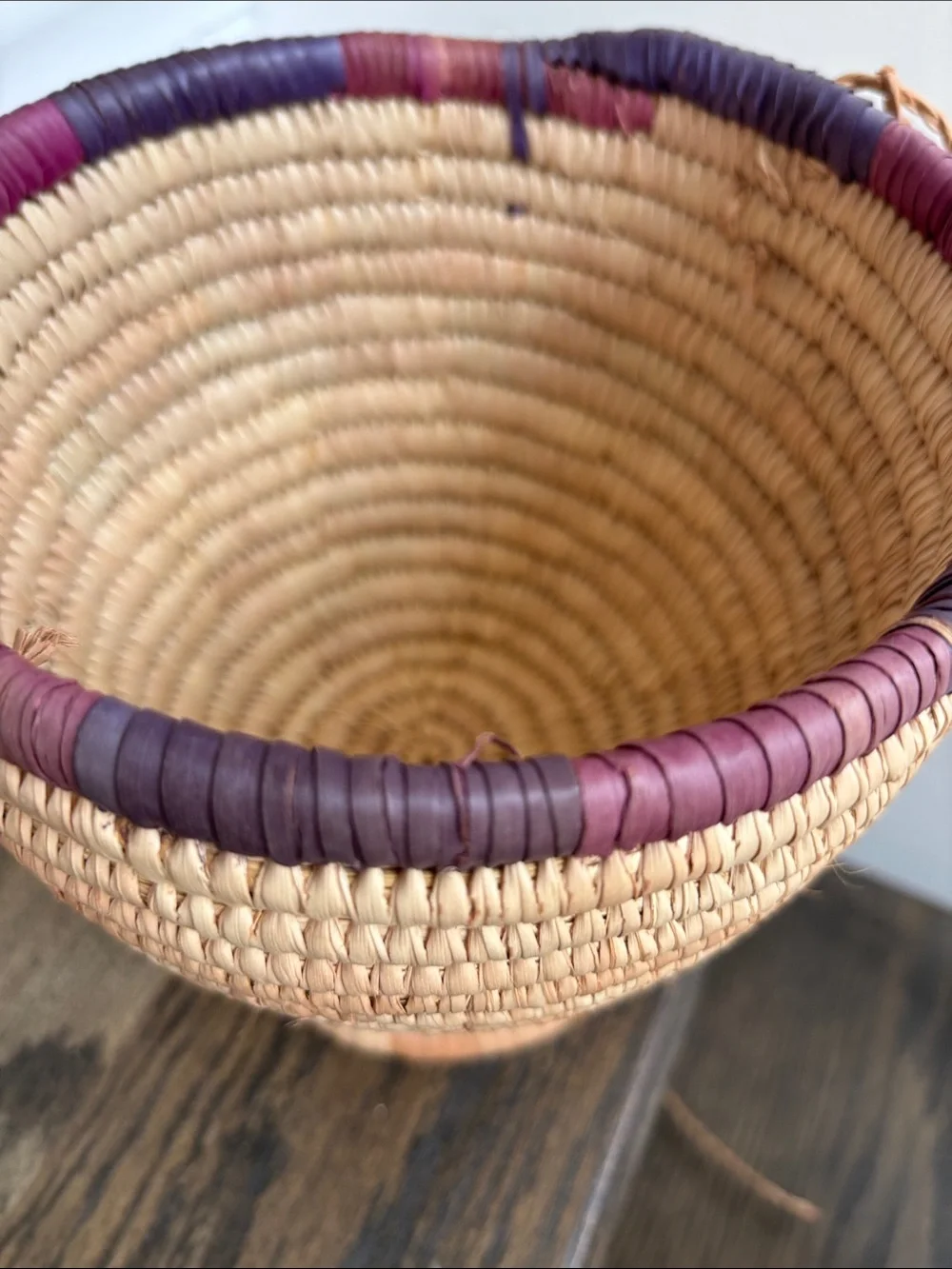 Woven palm leaves? footed basket, purple stripe on rim, 7.5” tall